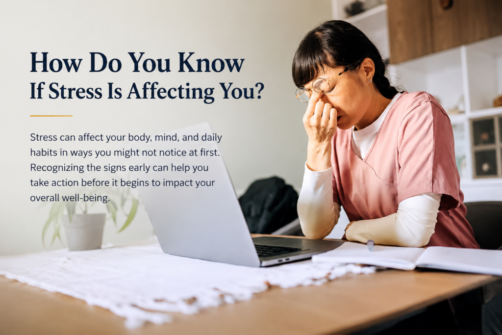 Stressed woman sitting at a laptop and holding her forehead, illustrating how stress can affect daily life and overall well-being.